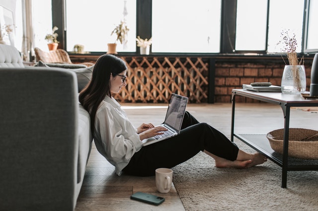 A woman looking at a computer.