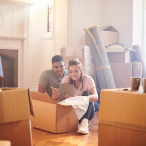 couple in new house with moving boxes