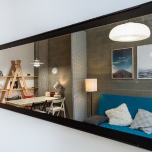 A mirror in a small living room.