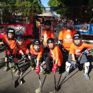 Kids playing street hockey