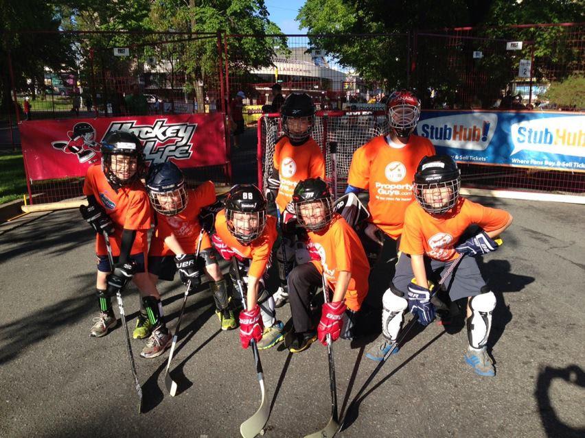 Kids playing street hockey