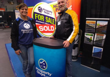 Rick Davies at trade show with PropertyGuys.com