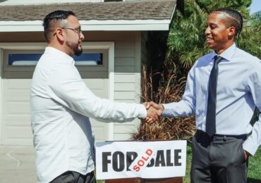 A buyer shaking hands with a seller