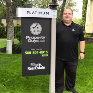 Jeff Cormier with PropertyGuys.com platinum for sale sign