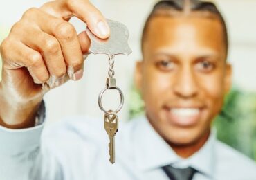 a seller handing over a key