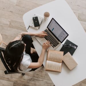 woman works on laptop at desk