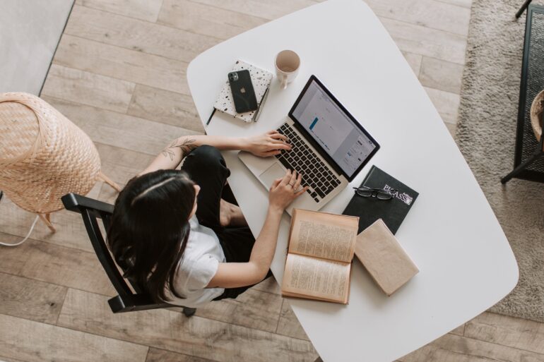 woman works on laptop at desk