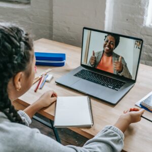 girl video conferencing with a tutor