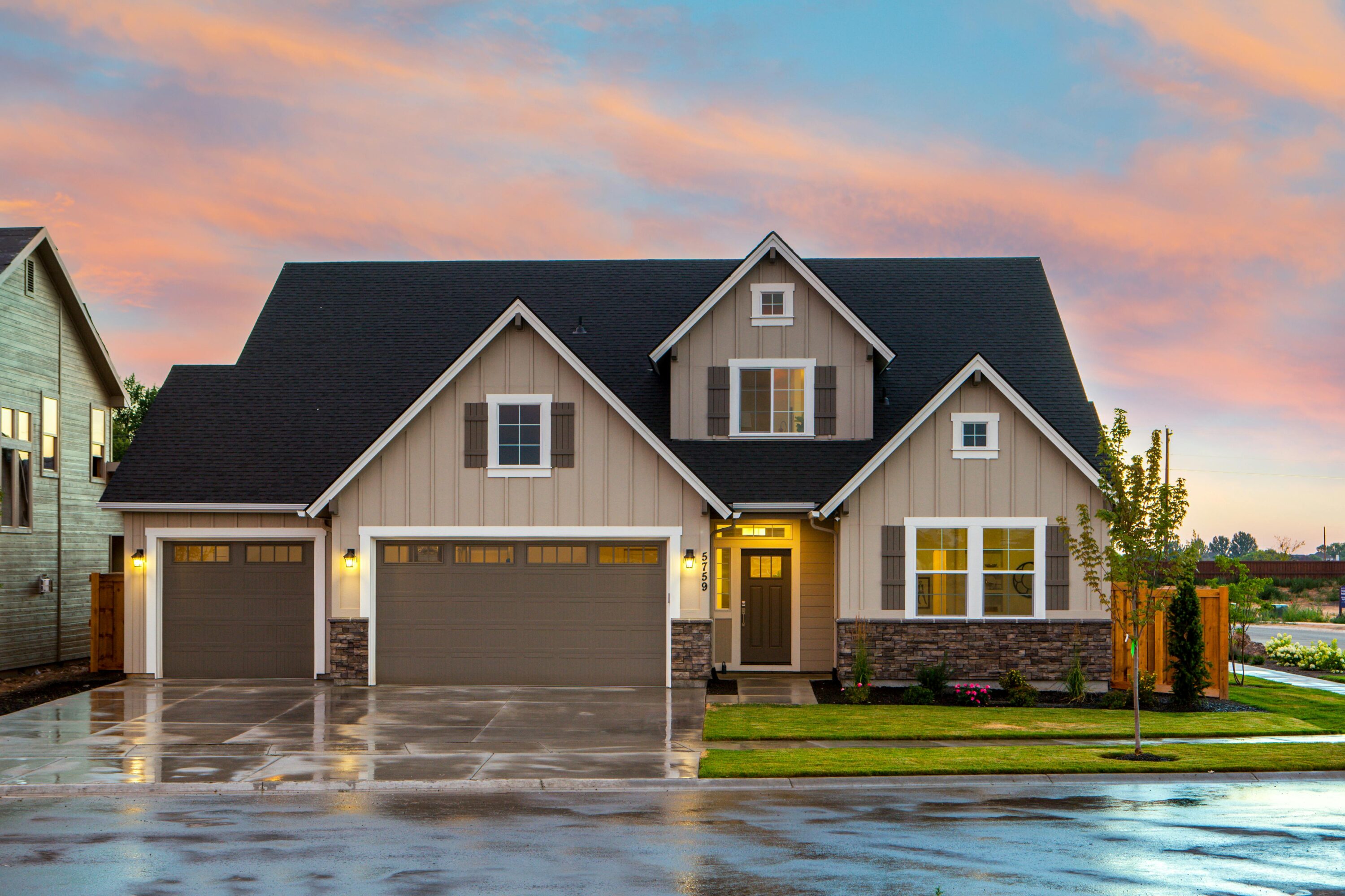 Alt: A brown house with lights on
