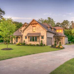 A brown house with a yard