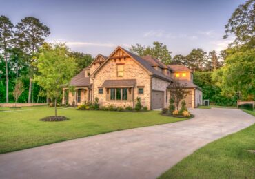 A brown house with a yard