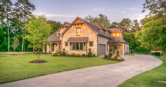 A brown house with a yard