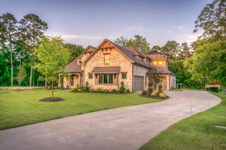 A brown house with a yard