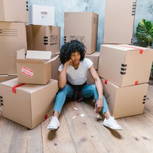 a woman thinking about what to do when moving dates do not align with closing dates