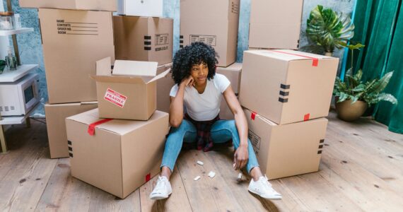 a woman thinking about what to do when moving dates do not align with closing dates