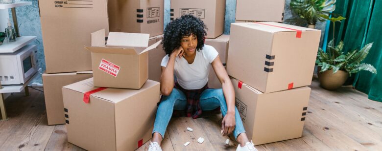 a woman thinking about what to do when moving dates do not align with closing dates